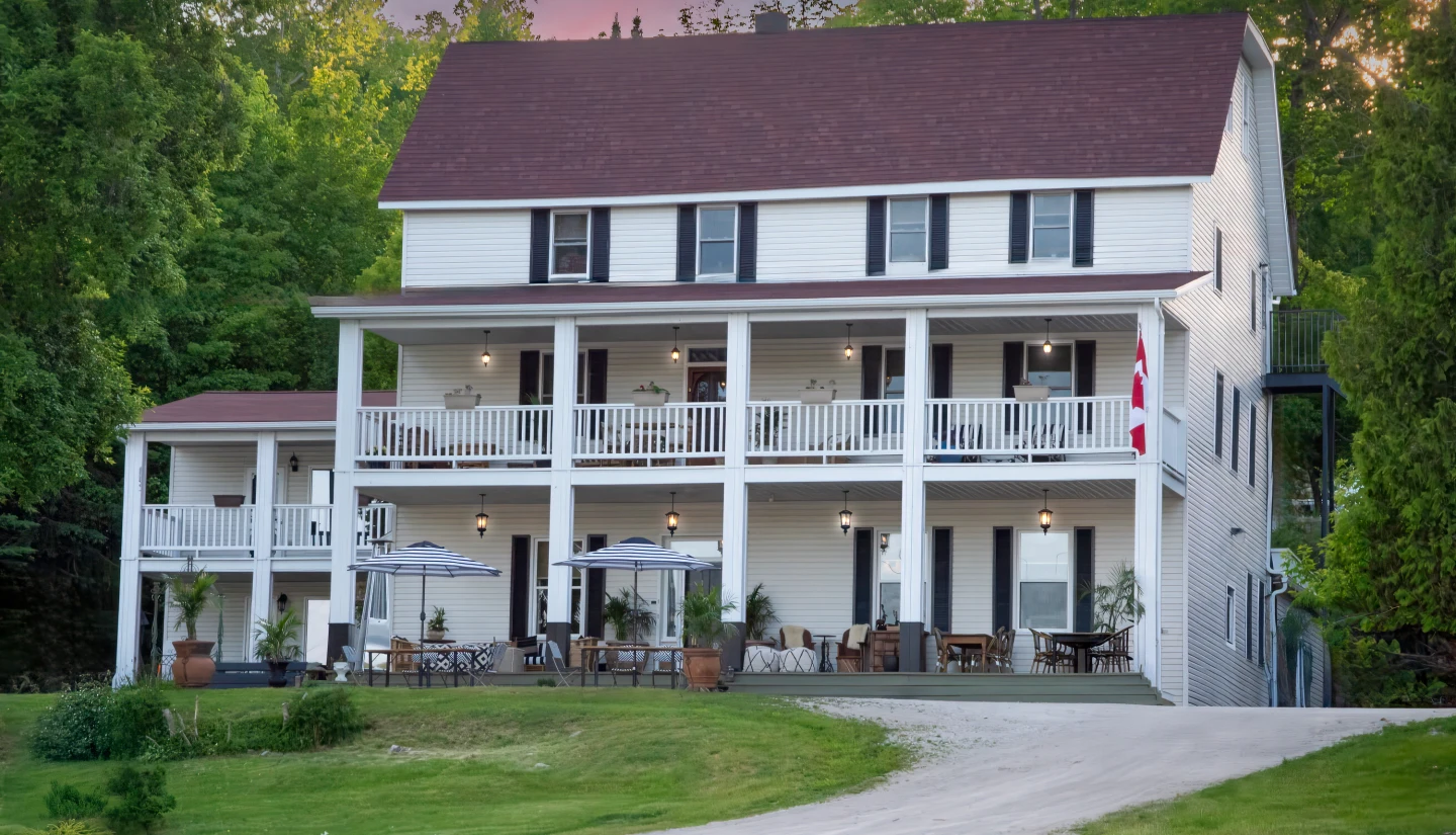 The Queen’s Inn exterior and front veranda in Gore Bay